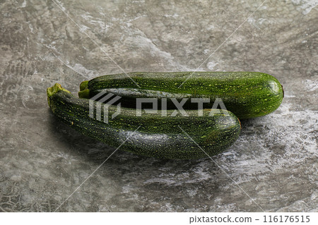 Raw young small green zucchini Raw young small green zucchini 116176515