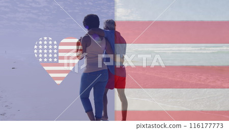 Image of america flag in heart over american flag, african american couple walking on beach Image of america flag in heart over american flag, african american couple walking on beach 116177773