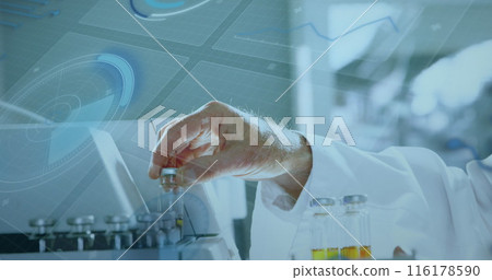 A scientist wearing lab coat holding a vial near test tubes in a laboratory 116178590
