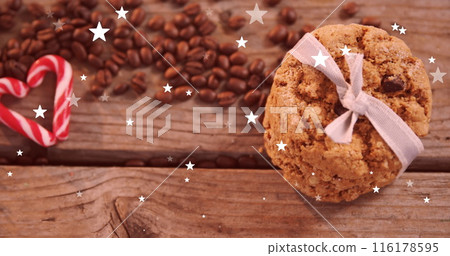Imaged of falling stars over cookies and coffee beans 116178595