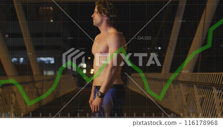 Caucasian man wearing shorts, exercising in the city streets during a night, taking a break while ru 116178968