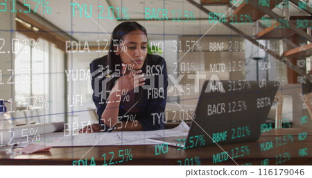 Image of stock market data processing over african american woman working on her plan Image of stock market data processing over african american woman working on her plan 116179046