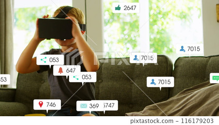 Image of social media icons with numbers over caucasian boy using vr headset Image of social media icons with numbers over caucasian boy using vr headset 116179203