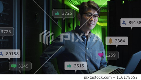 Image of social media icons over asian male engineer using laptop at server room Image of social media icons over asian male engineer using laptop at server room 116179552