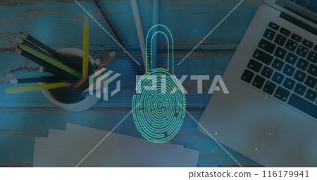 Laptop and school supplies are on wooden table 116179941