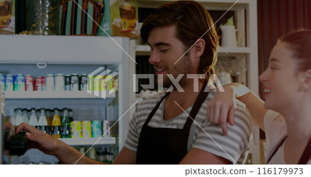 Image of multiple graphs and trading board over caucasian baristas discussing and making coffee 116179973