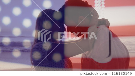 Image of flag of united states of america over happy diverse couple in love on beach Image of flag of united states of america over happy diverse couple in love on beach 116180149