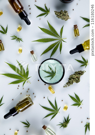 Bottles with hemp oil and cannabis leaves, marijuana  on white background 116180246