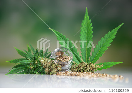 Cannabis leaf with hemp seeds and marijuana oil, cbd Cannabis leaf with hemp seeds and marijuana oil, cbd 116180269