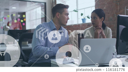 Image of digital icons over diverse business people in office Image of digital icons over diverse business people in office 116181776