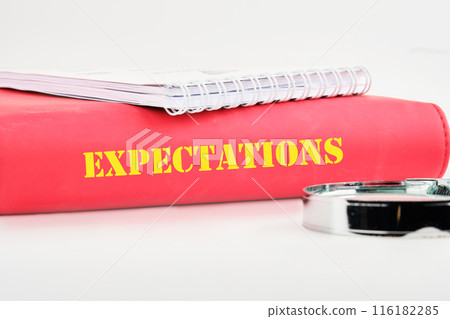 inscription Expectations word on the cover of the book on a white background 116182285