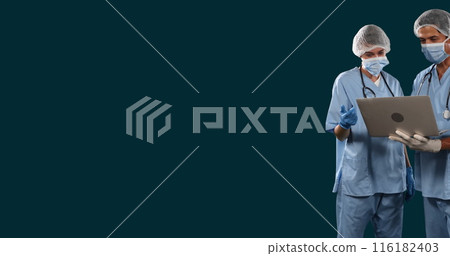 Image of diverse doctors discussing patient reports on laptop against black background 116182403