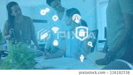 Image of multiple icons over diverse coworkers discussing about blueprint in office Image of multiple icons over diverse coworkers discussing about blueprint in office 116182536