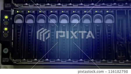 Rows of hard drives glowing in blue inside server rack Rows of hard drives glowing in blue inside server rack 116182798
