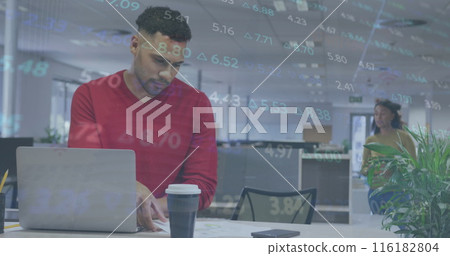 Biracial coworker wearing red is typing on laptop, diverse coworker in background 116182804
