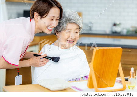 Caregiver and senior women 116183015