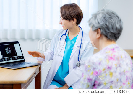 Doctor examining an elderly person Doctor examining an elderly person 116183034