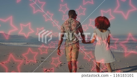 Image of neon stars over back of african american couple walking on beach 116183101