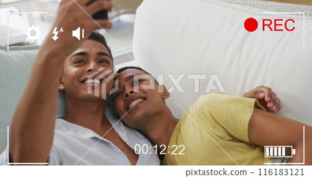 Image of digital interface over happy biracial male gay couple 116183121