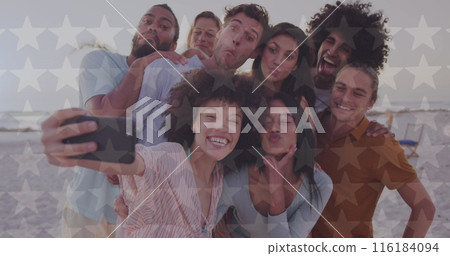 Image of happy independence day text and light spots over diverse friends at beach 116184094