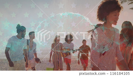 A group of friends are enjoying a sunset walk on a tropical beach A group of friends are enjoying a sunset walk on a tropical beach 116184105