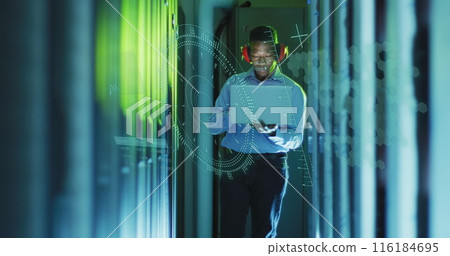 Image of data processing over african american male worker with laptop in server room 116184695