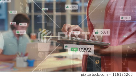 Image of social media icons against mid section of a woman using digital tablet at office 116185263