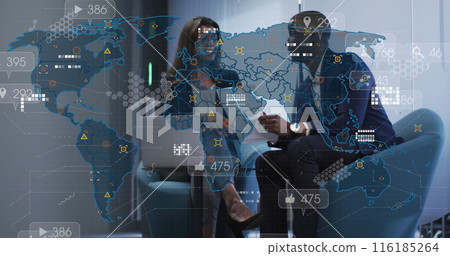 Image of social media icons against diverse businessman and businesswoman discussing at office 116185264