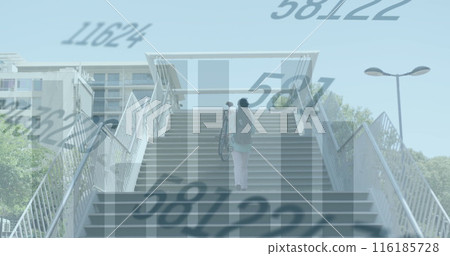 Image of changing numbers, graphs, rear view of man carrying bicycle while walking up stairs 116185728