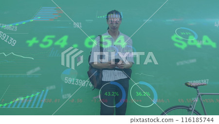 Image of graphs, changing numbers and trading board, biracial man beside bicycle using cellphone 116185744