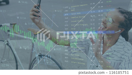 Image of graphs and trading board over biracial ma vlogging on cellphone Image of graphs and trading board over biracial ma vlogging on cellphone 116185751