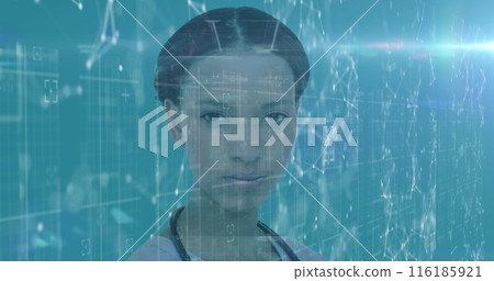 African American woman standing in front of digital screens, wearing simple top 116185921