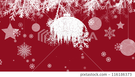 Snowflakes and ornaments hanging against red background Snowflakes and ornaments hanging against red background 116186373