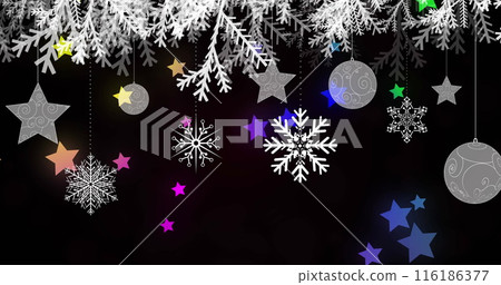 Snowflakes and stars hanging against dark background, glowing softly 116186377