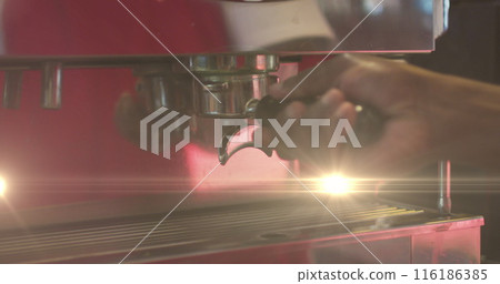 A person preparing coffee using espresso machine A person preparing coffee using espresso machine 116186385