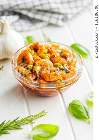 Fresh salad with shrimps and edamame soybeans in bowl on white table. 116186506