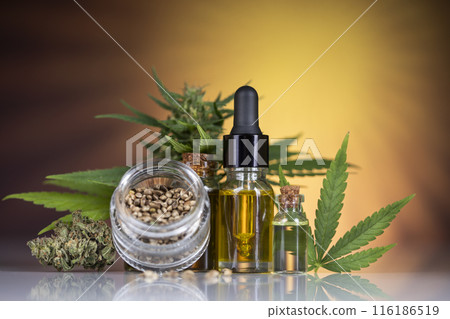 Hemp oil bottle with hemp leaf and cannabis leaf, marijuana Hemp oil bottle with hemp leaf and cannabis leaf, marijuana 116186519