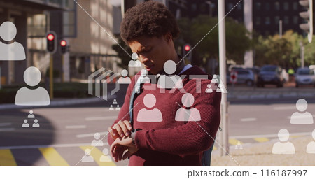 Image of people icons and data processing over african american man using smartwatch Image of people icons and data processing over african american man using smartwatch 116187997