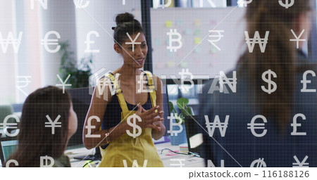 Image of currency symbols against african american woman talking to diverse colleagues at office 116188126