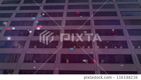Image of red blue and white spots over building 116188216