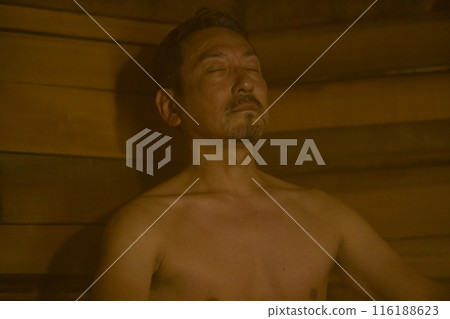 A man in his 50s enjoying the sauna 116188623