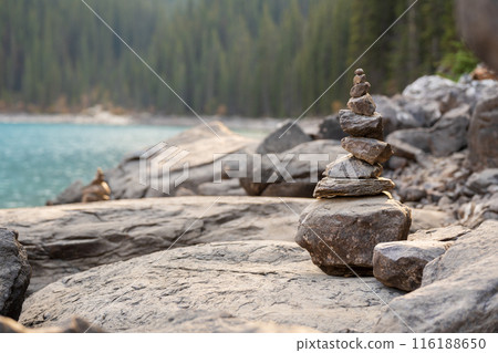 Balancing stones on the shore of the lake. Stack of stones, Pile of rocks, stones tower. Spirit of Zen. 116188650