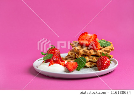 Sweet Belgian waffles with strawberries. 116188684