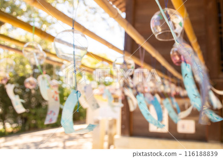 Wind chimes swaying in the wind 116188839