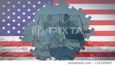 Image of american flag jigsaw puzzles revealing senior couple with drinks in deckchairs on beach 116189807