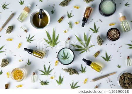 Bottles with hemp oil and cannabis leaves, marijuana on white background Bottles with hemp oil and cannabis leaves, marijuana on white background 116190018