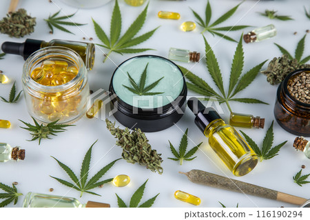 Composition, hemp oil, cannabis leaves, marijuana, Flat lay on white background Composition, hemp oil, cannabis leaves, marijuana, Flat lay on white background 116190294