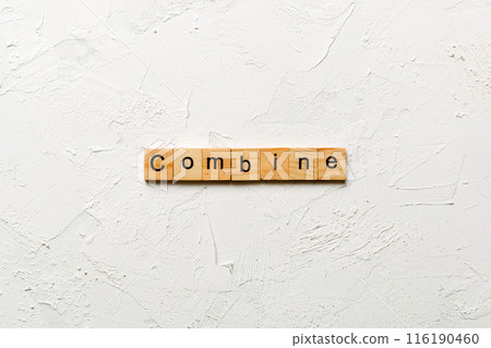 COMBINE word written on wood block. COMBINE text on cement table for your desing, concept COMBINE word written on wood block. COMBINE text on cement table for your desing, concept 116190460