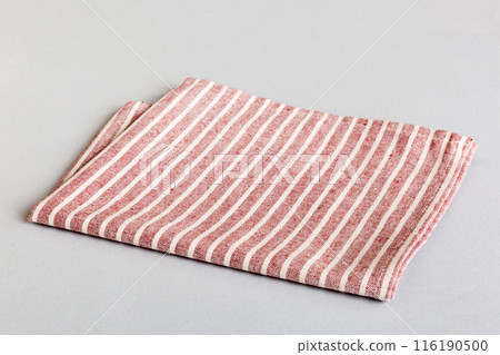 top view with red empty kitchen napkin isolated on table background. Folded cloth for mockup with copy space, Flat lay. Minimal style top view with red empty kitchen napkin isolated on table background. Folded cloth for mockup with copy space, Flat lay. Minimal style 116190500