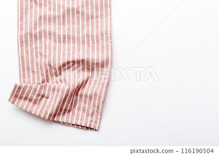 top view with red empty kitchen napkin isolated on table background. Folded cloth for mockup with copy space, Flat lay. Minimal style 116190504